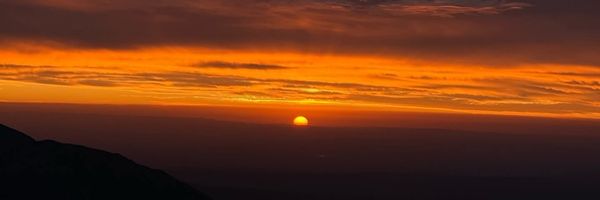 High Atlas sunrise above Imlil—small, safety-focused trekking groups led by licensed local guide Mouad Maskouk